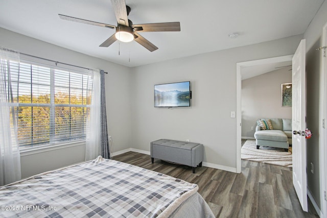 bedroom with ceiling fan and dark hardwood / wood-style floors