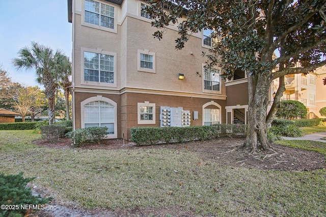 exterior space with a front lawn