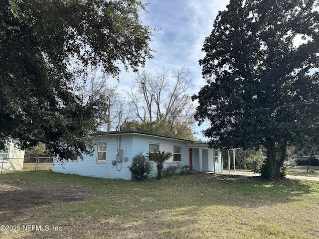 view of property exterior featuring a yard