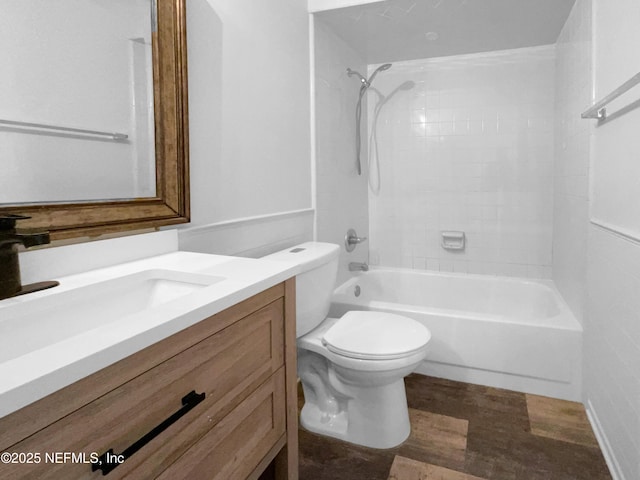 full bathroom featuring vanity, hardwood / wood-style flooring, toilet, and tiled shower / bath