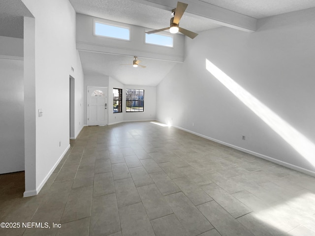 unfurnished living room featuring a textured ceiling, plenty of natural light, and ceiling fan