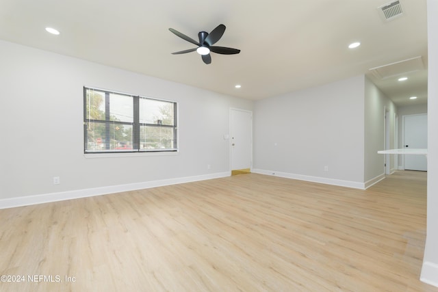 empty room featuring ceiling fan and light wood-type flooring