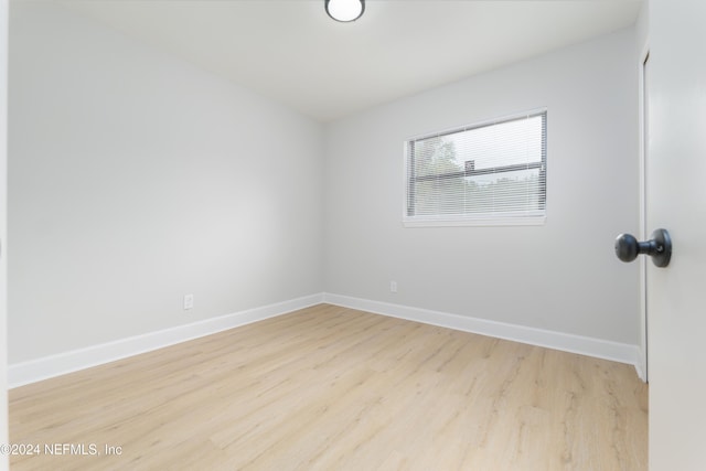 unfurnished room featuring light hardwood / wood-style flooring