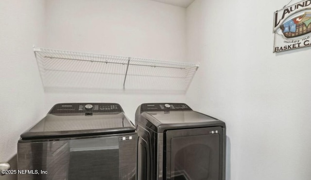 laundry area with laundry area and independent washer and dryer