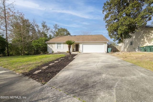 ranch-style house featuring a front lawn, driveway, an attached garage, and fence