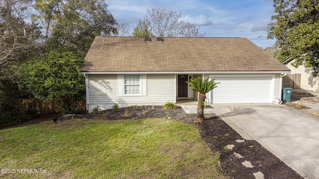 view of front of home with a garage, concrete driveway, roof with shingles, fence, and a front lawn