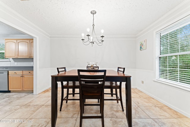 dining room with a healthy amount of sunlight, a chandelier, a textured ceiling, and ornamental molding