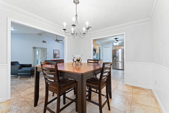 dining room featuring vaulted ceiling with beams, a textured ceiling, and ceiling fan with notable chandelier