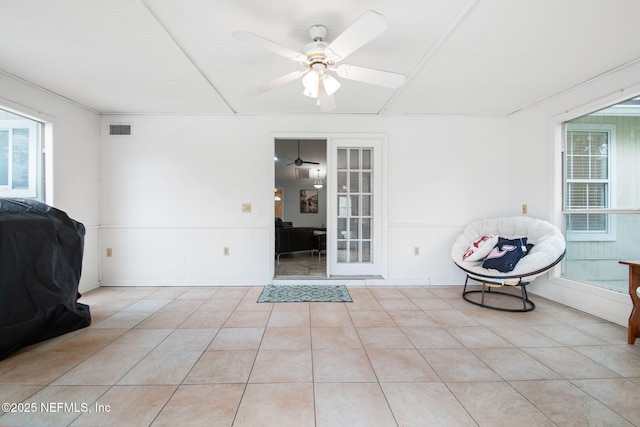 interior space with visible vents, a ceiling fan, and a patio