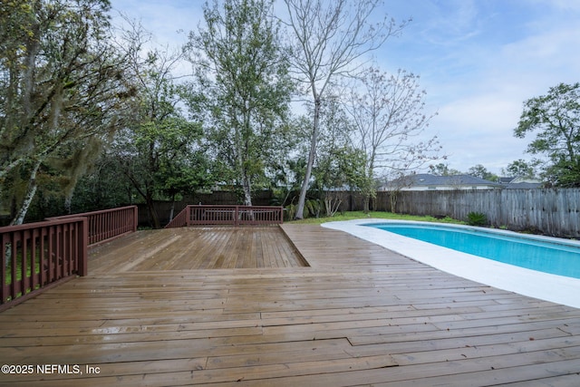 view of pool featuring a fenced in pool, a fenced backyard, and a deck