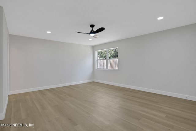 empty room featuring light hardwood / wood-style floors and ceiling fan