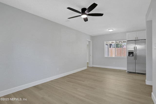 unfurnished room with ceiling fan and light hardwood / wood-style flooring