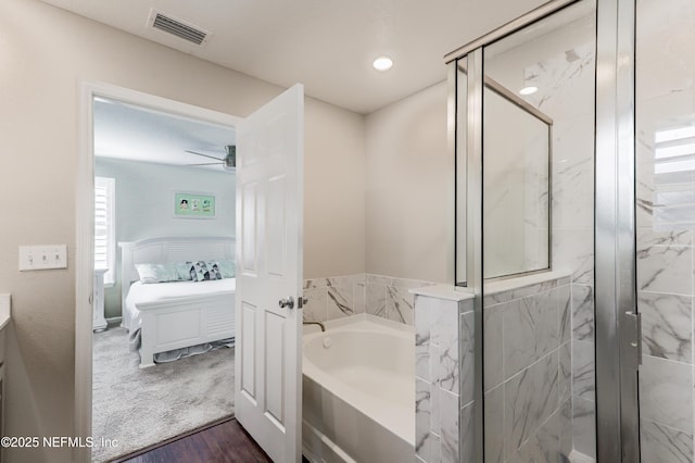 bathroom featuring shower with separate bathtub, wood-type flooring, and ceiling fan