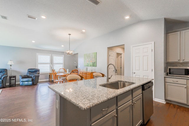 kitchen featuring appliances with stainless steel finishes, pendant lighting, sink, gray cabinetry, and a center island with sink