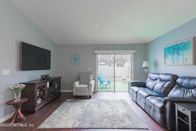 living room with dark hardwood / wood-style flooring and vaulted ceiling