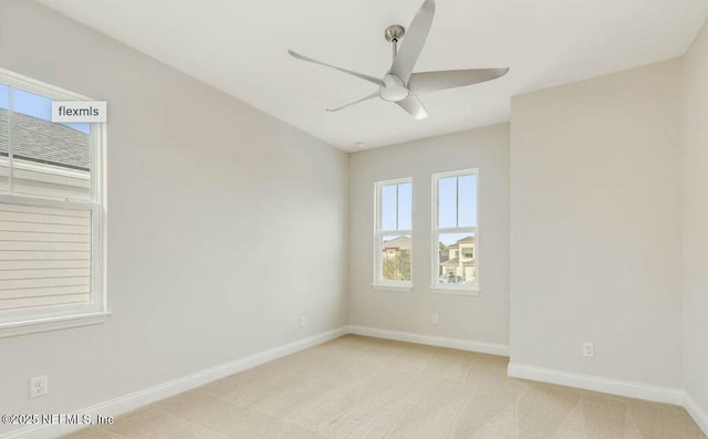 carpeted empty room with ceiling fan