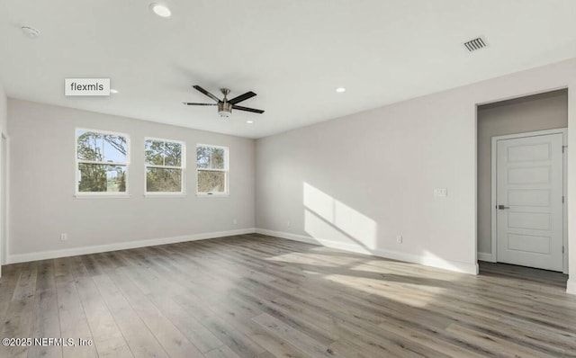 unfurnished room featuring wood-type flooring and ceiling fan