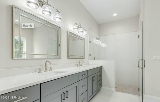 bathroom with a shower with door and vanity