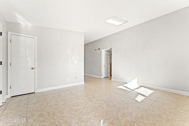 empty room with light tile patterned floors