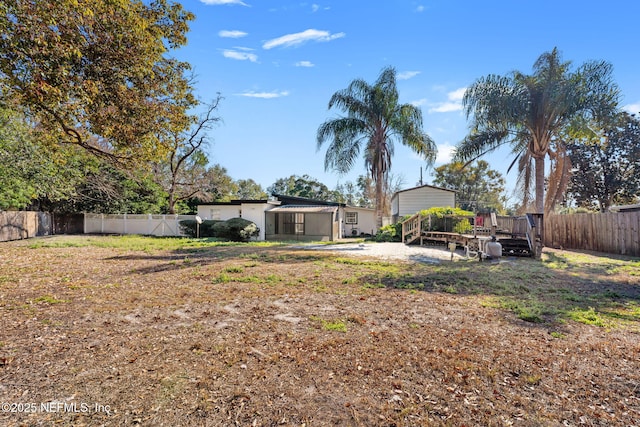 view of yard featuring a deck