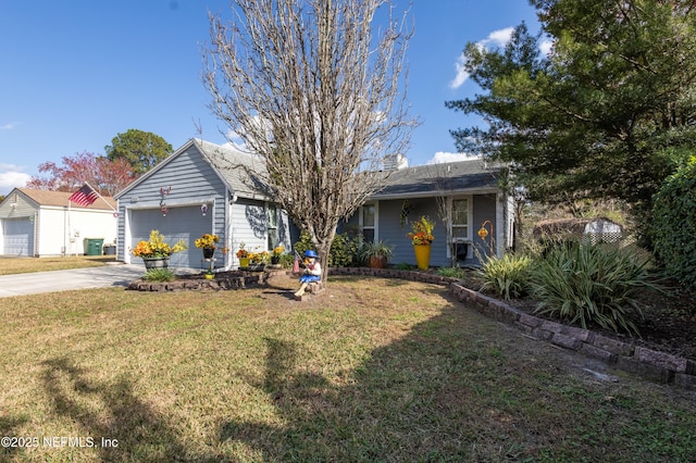 view of front of house with a garage and a front yard