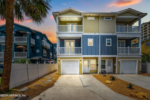 multi unit property featuring a garage