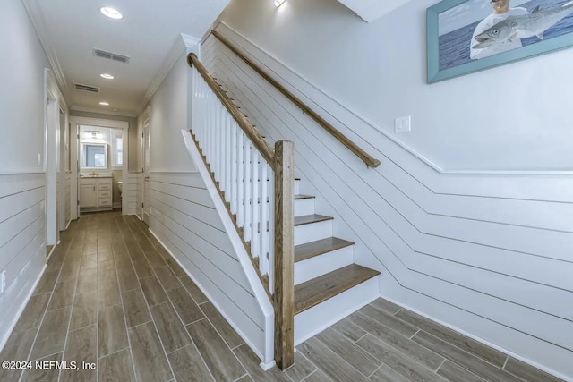 stairs with wood walls