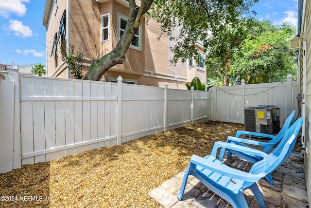 view of yard featuring central AC unit