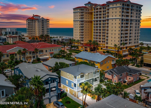 aerial view at dusk with a water view