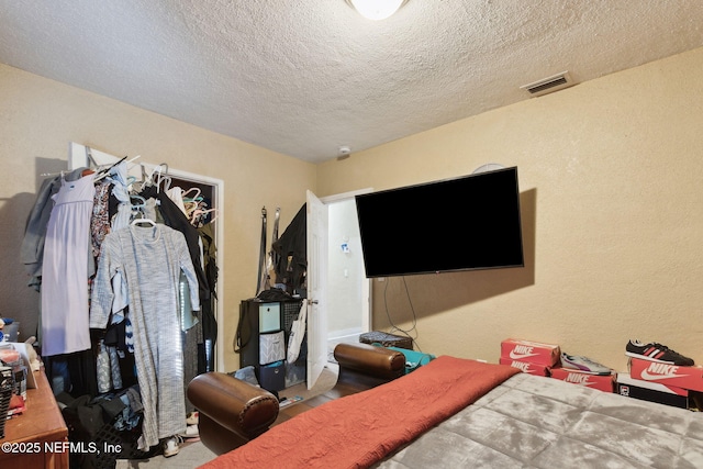 bedroom featuring a textured ceiling