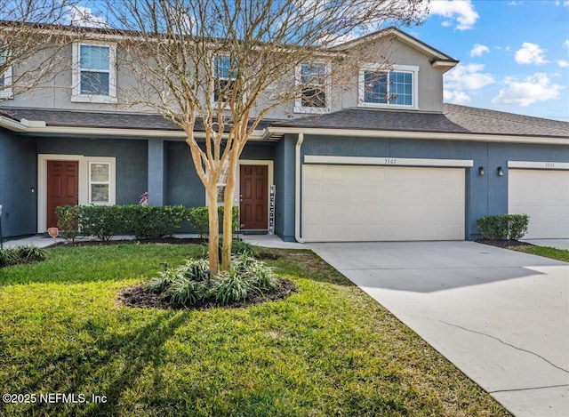 view of front of house featuring a garage and a front yard