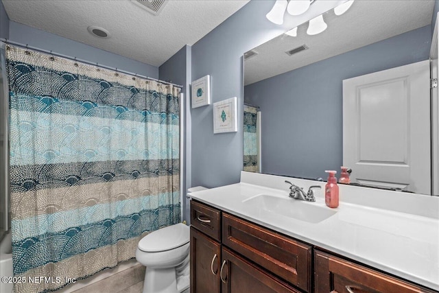 bathroom featuring tile patterned flooring, vanity, toilet, a textured ceiling, and a shower with curtain