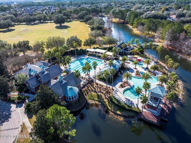 birds eye view of property with a water view