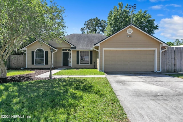 ranch-style home featuring a garage and a front yard