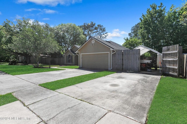 view of front of home featuring a garage and a front yard