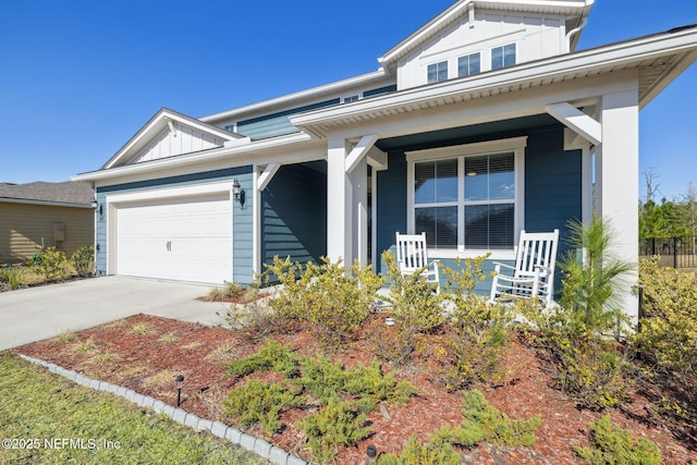 view of front of home featuring a garage and covered porch