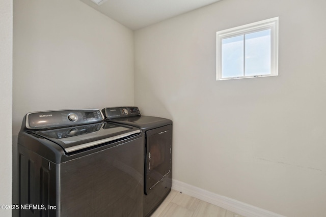 washroom featuring washer and clothes dryer