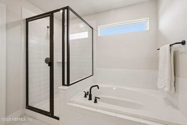 bathroom featuring plus walk in shower