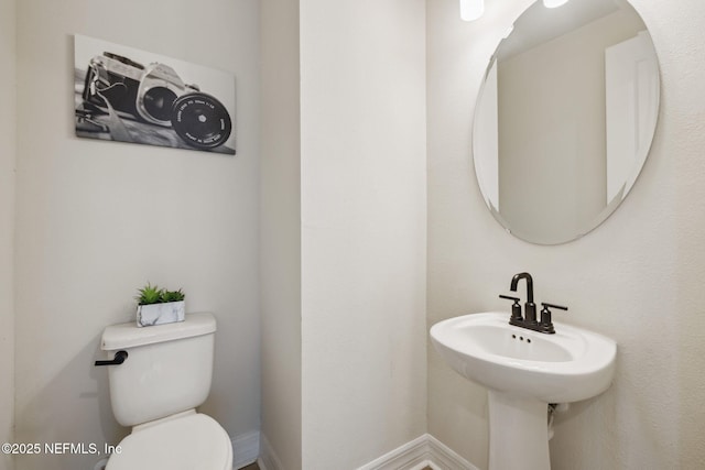 bathroom with sink and toilet