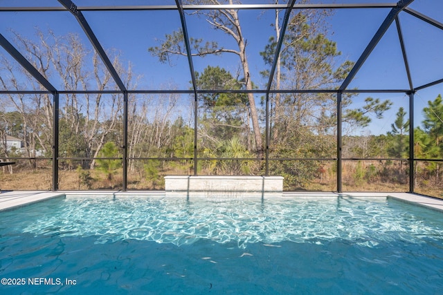 view of swimming pool with a lanai