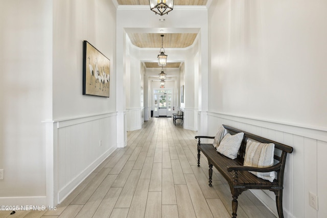 hallway featuring crown molding and wood-type flooring