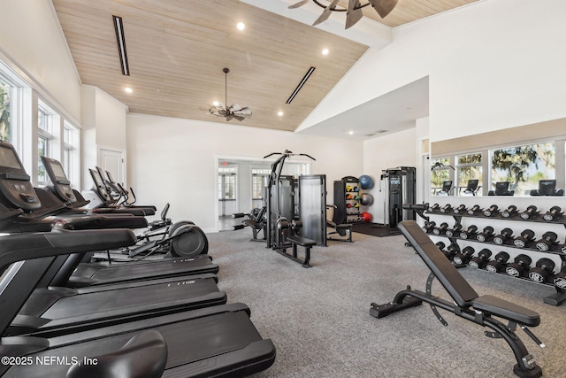 workout area featuring high vaulted ceiling, wooden ceiling, and a healthy amount of sunlight