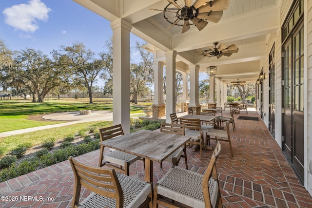 view of patio / terrace featuring ceiling fan