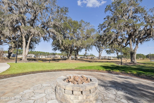 view of patio with an outdoor fire pit