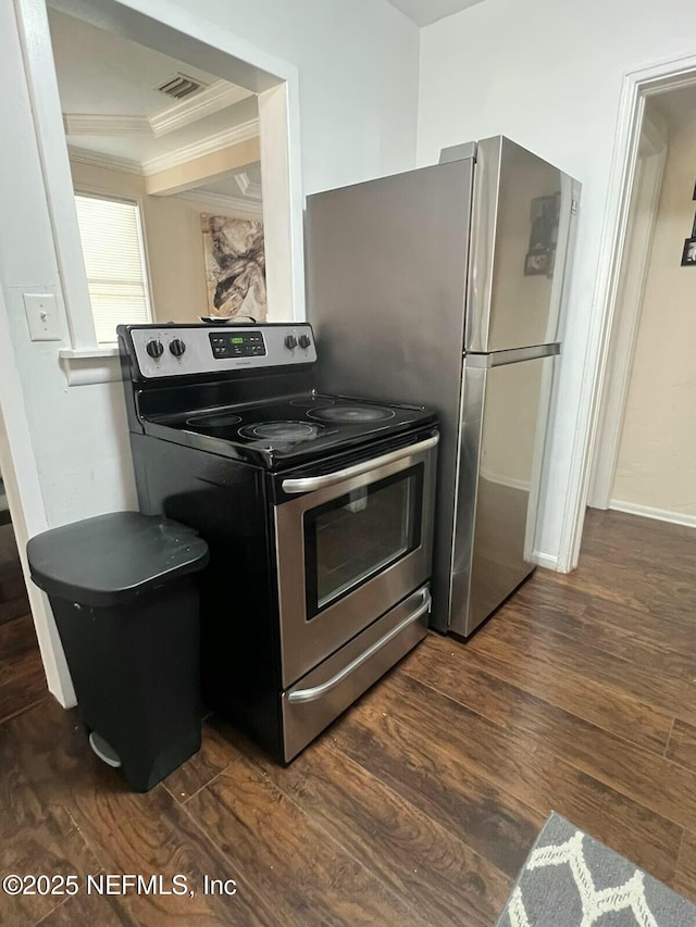 kitchen featuring crown molding, dark hardwood / wood-style floors, and stainless steel electric range