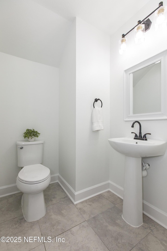 bathroom featuring sink and toilet