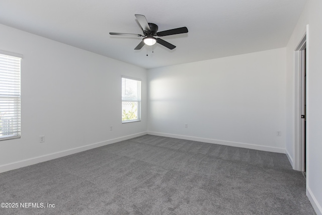 carpeted empty room with ceiling fan