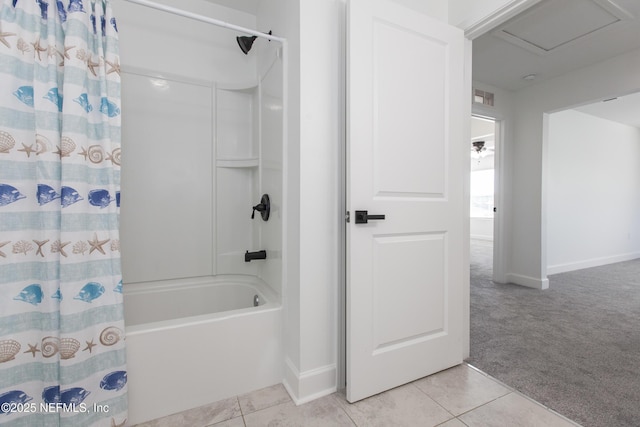 bathroom with tile patterned flooring and shower / bath combo