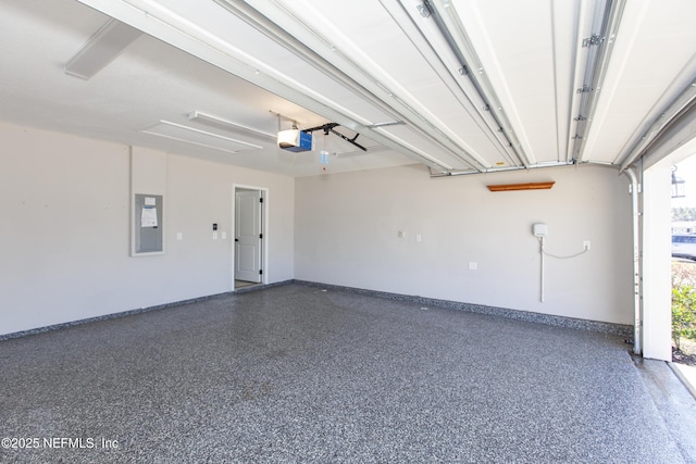 garage featuring a garage door opener and electric panel