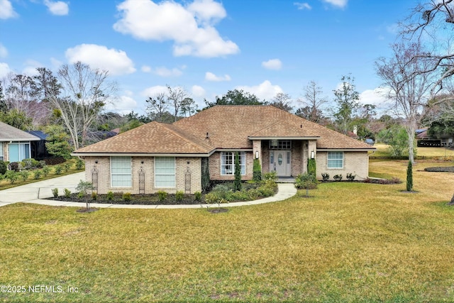 ranch-style home with a front lawn